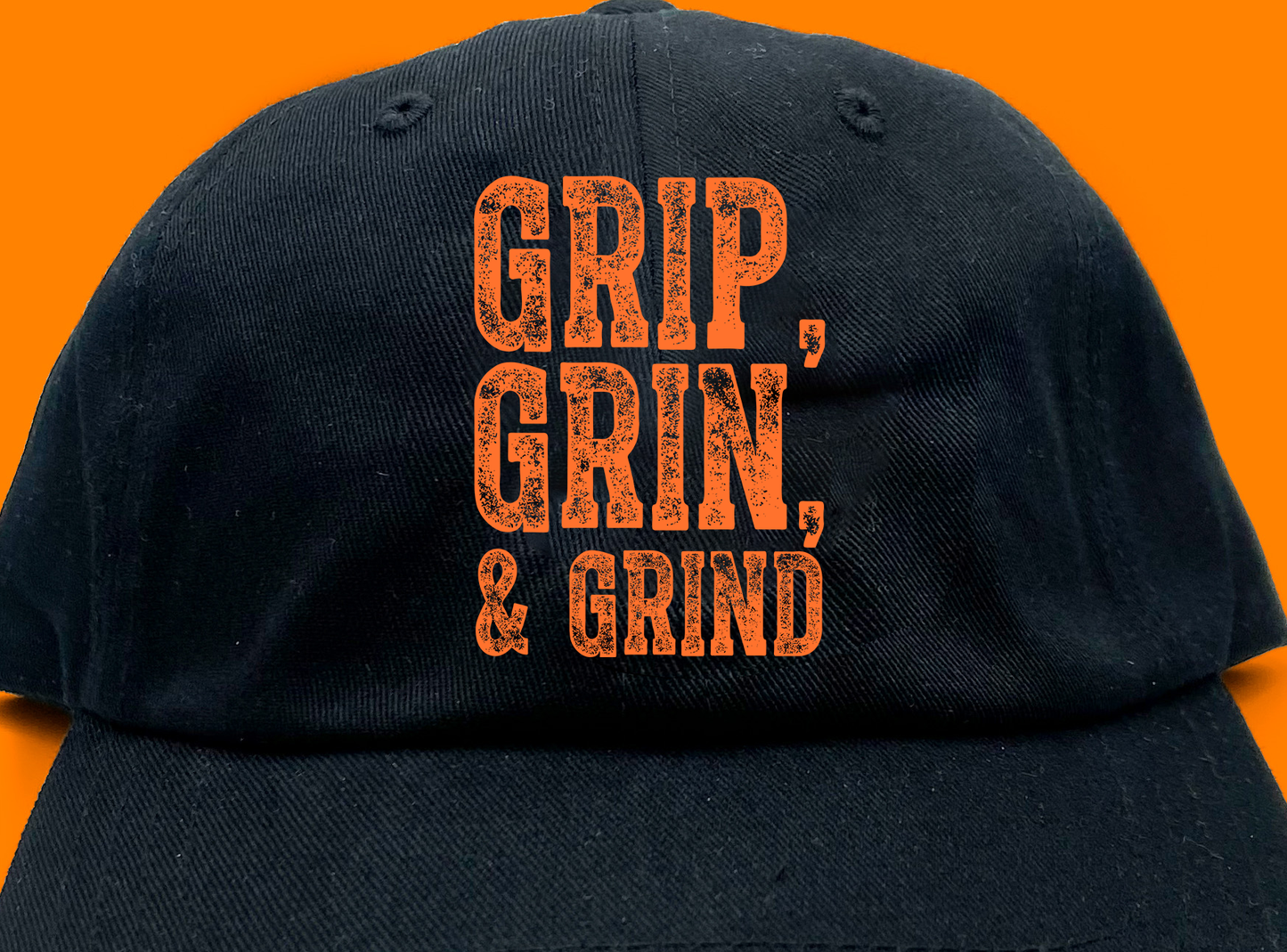 "Grip, Grin, & Grind" Orange Dad Hat