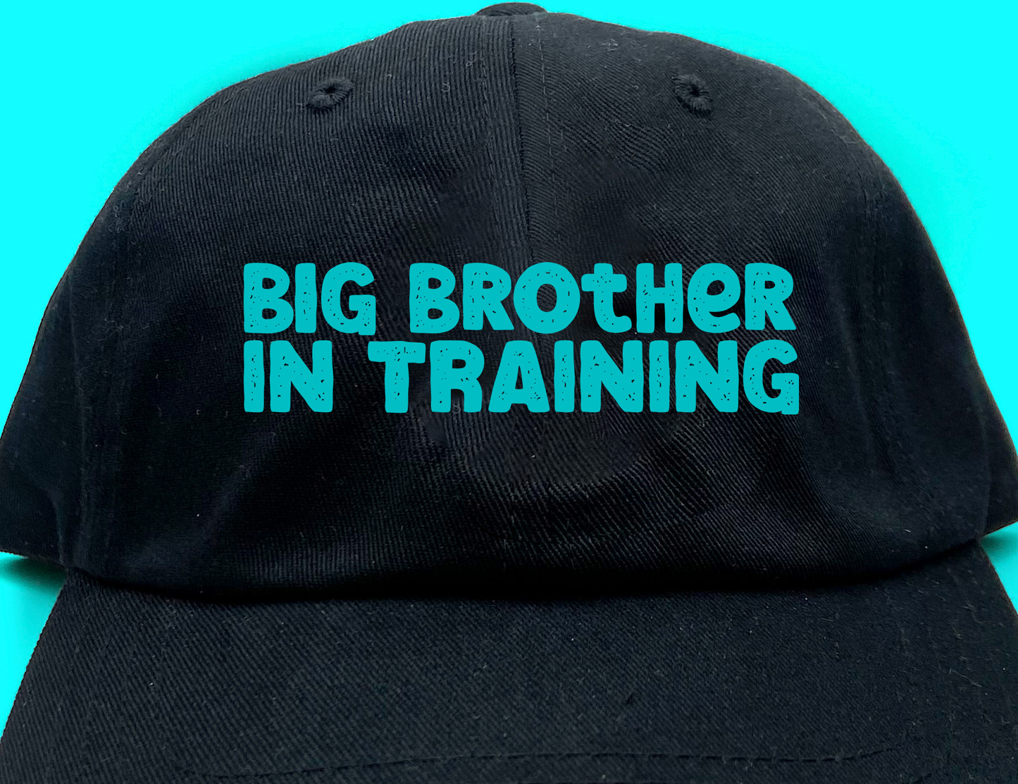 big brother in training light blue green dad hat
