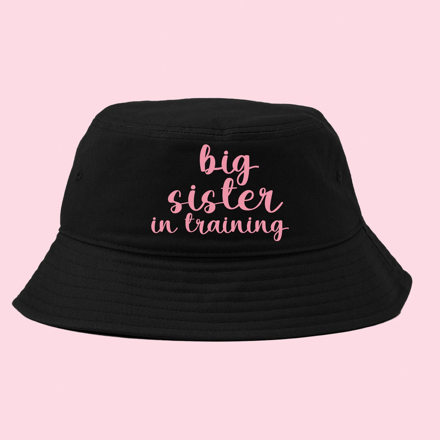 big sister in training pink bucket hat