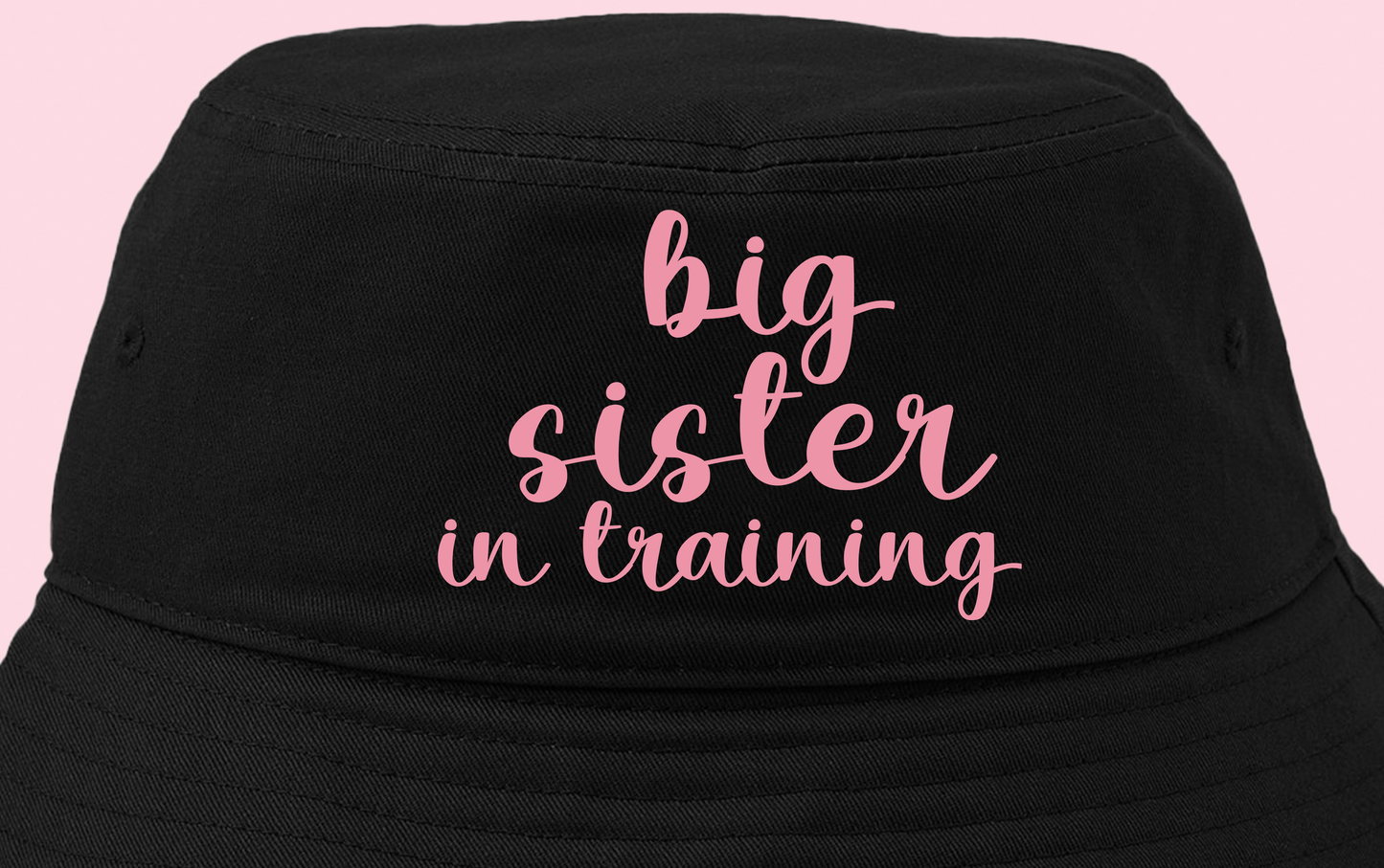 big sister in training pink bucket hat
