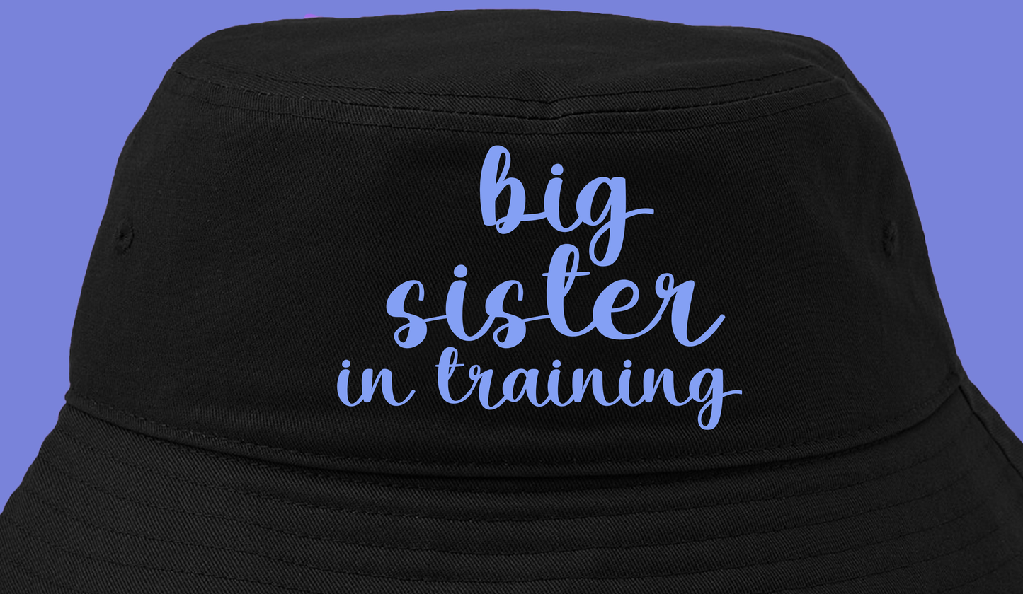 big sister in training purple bucket hat