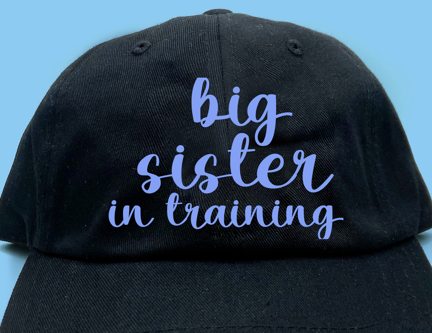 big sister in training purple dad hat