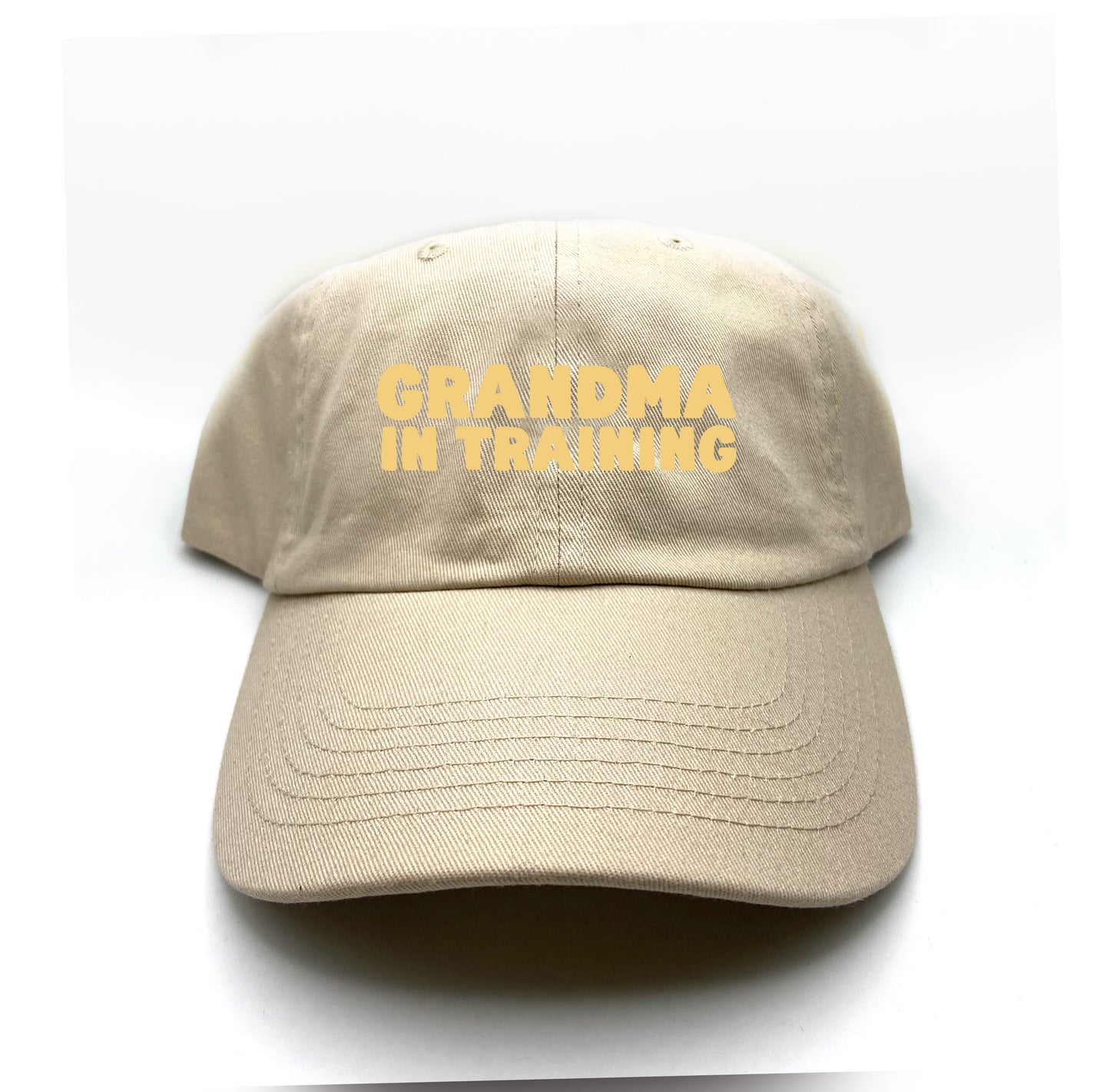 grandma in training cream dad hat