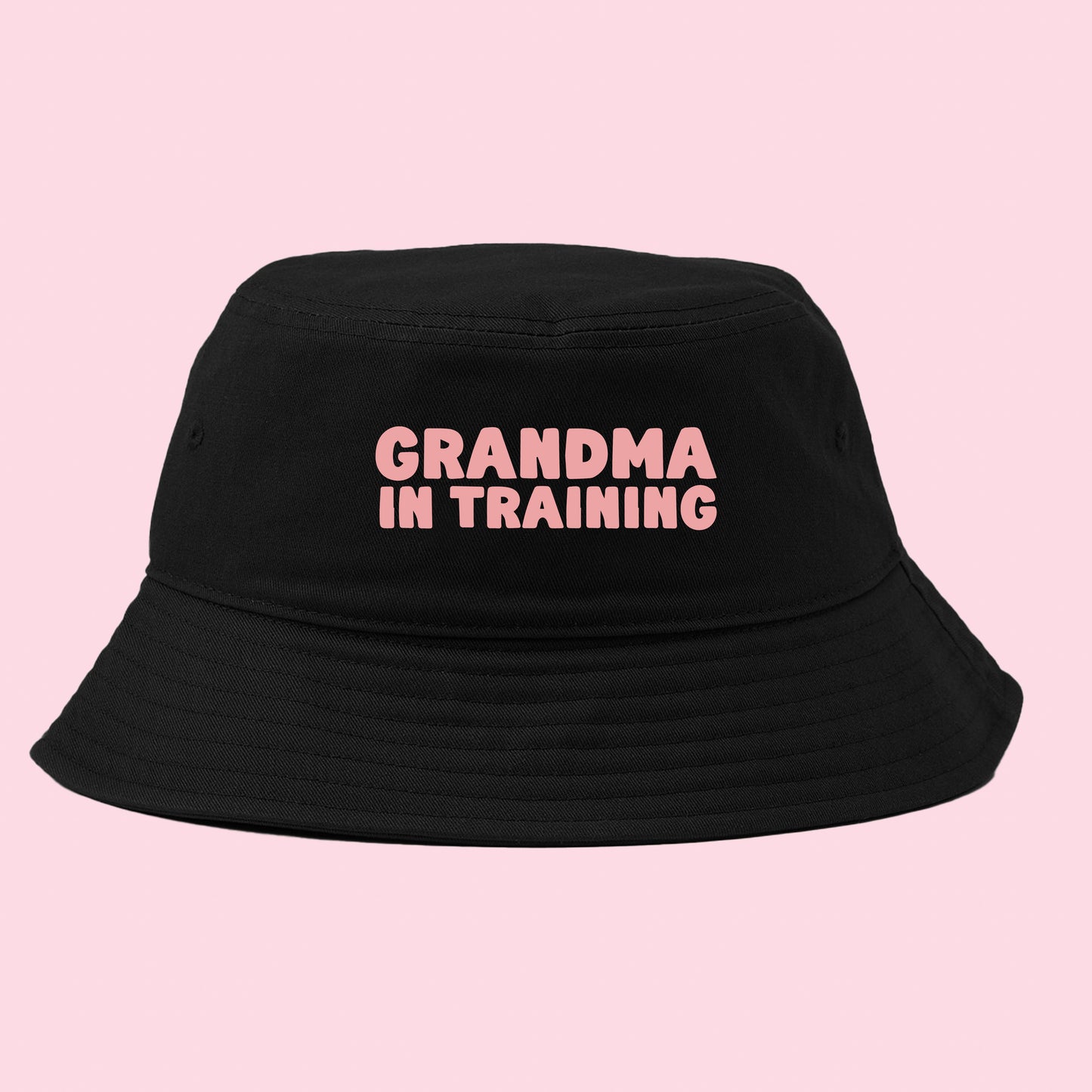 grandma in training pink bucket hat
