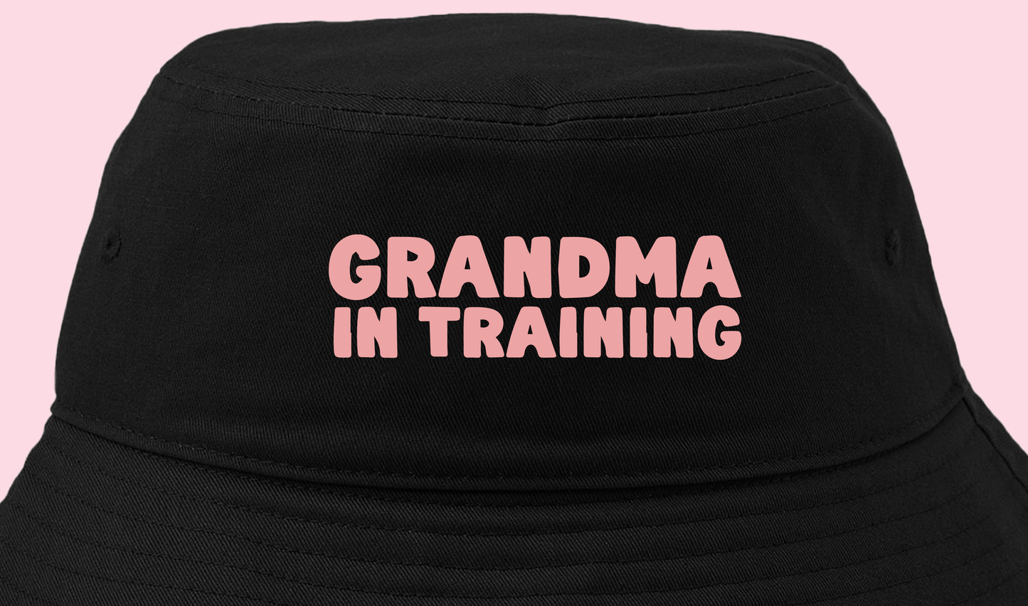 grandma in training pink bucket hat