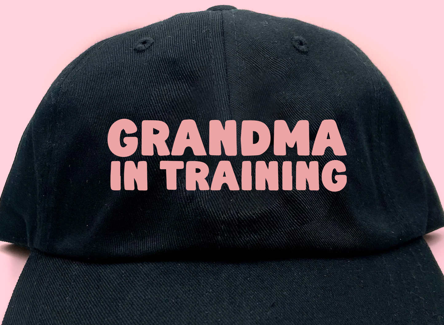grandma in training pink dad hat